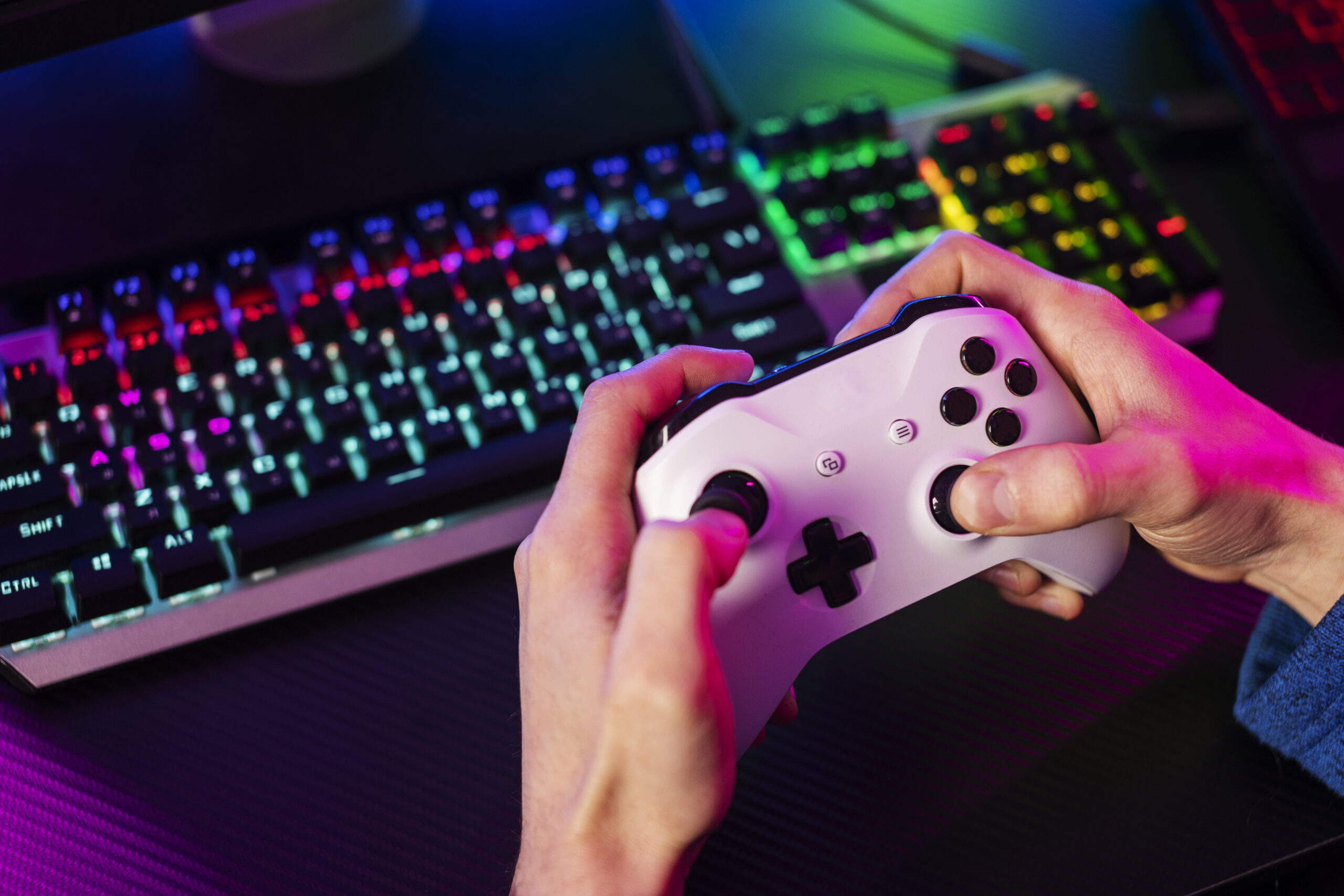 A Gamer Handling The Pad To dive Into The Gaming World