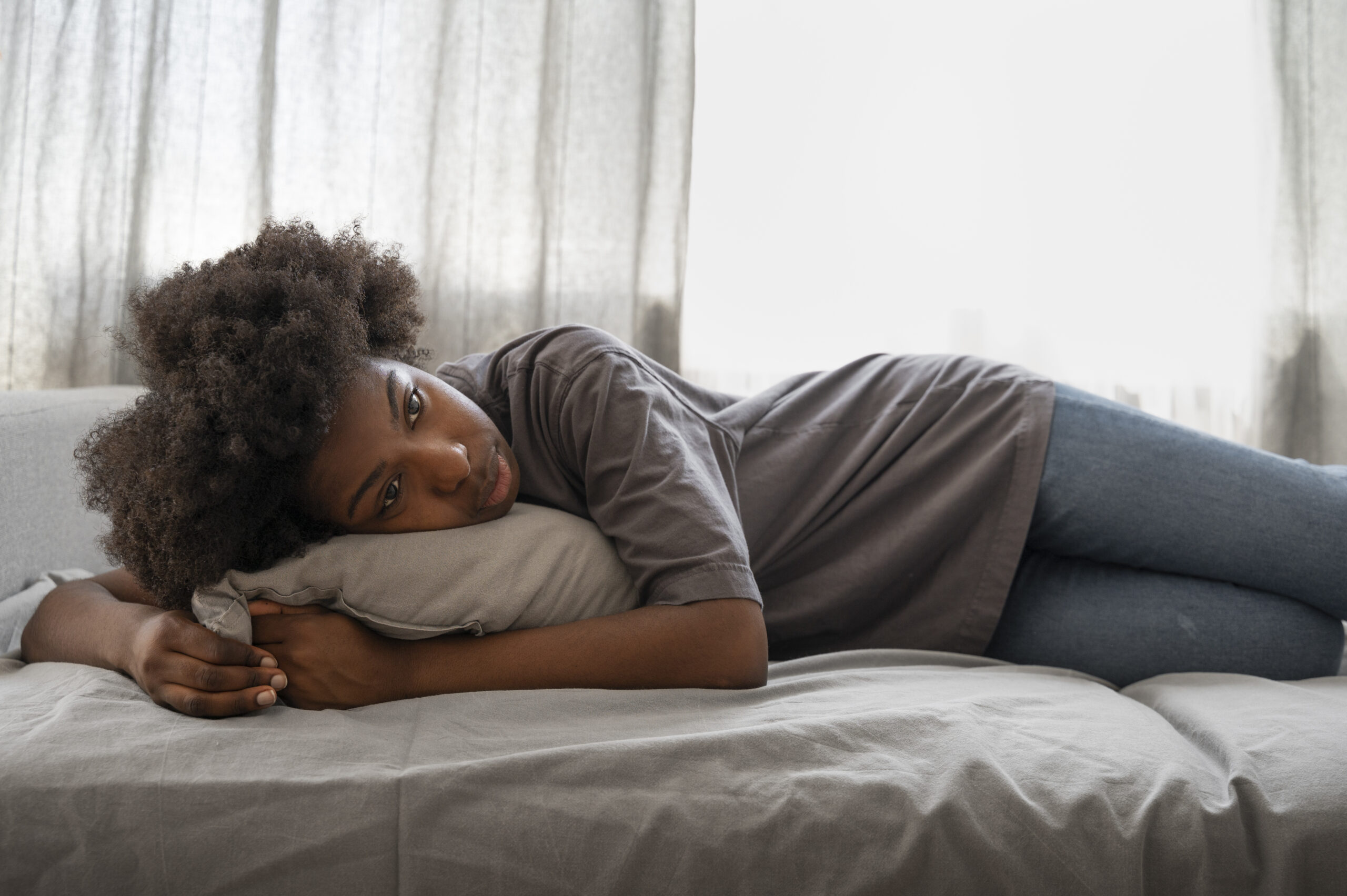 A Woman Relaxing After Waking From Sleep