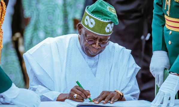 President Tinubu presents South-East Investment Company certificate to SEDC’s Mark Okoye at State House, Abuja, July 2025.