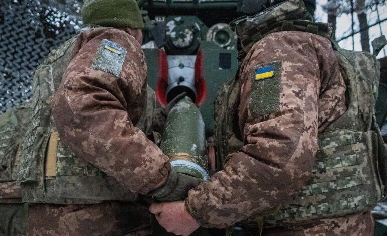 Military trucks involved in the transfer of fallen soldiers during wartime exchange
